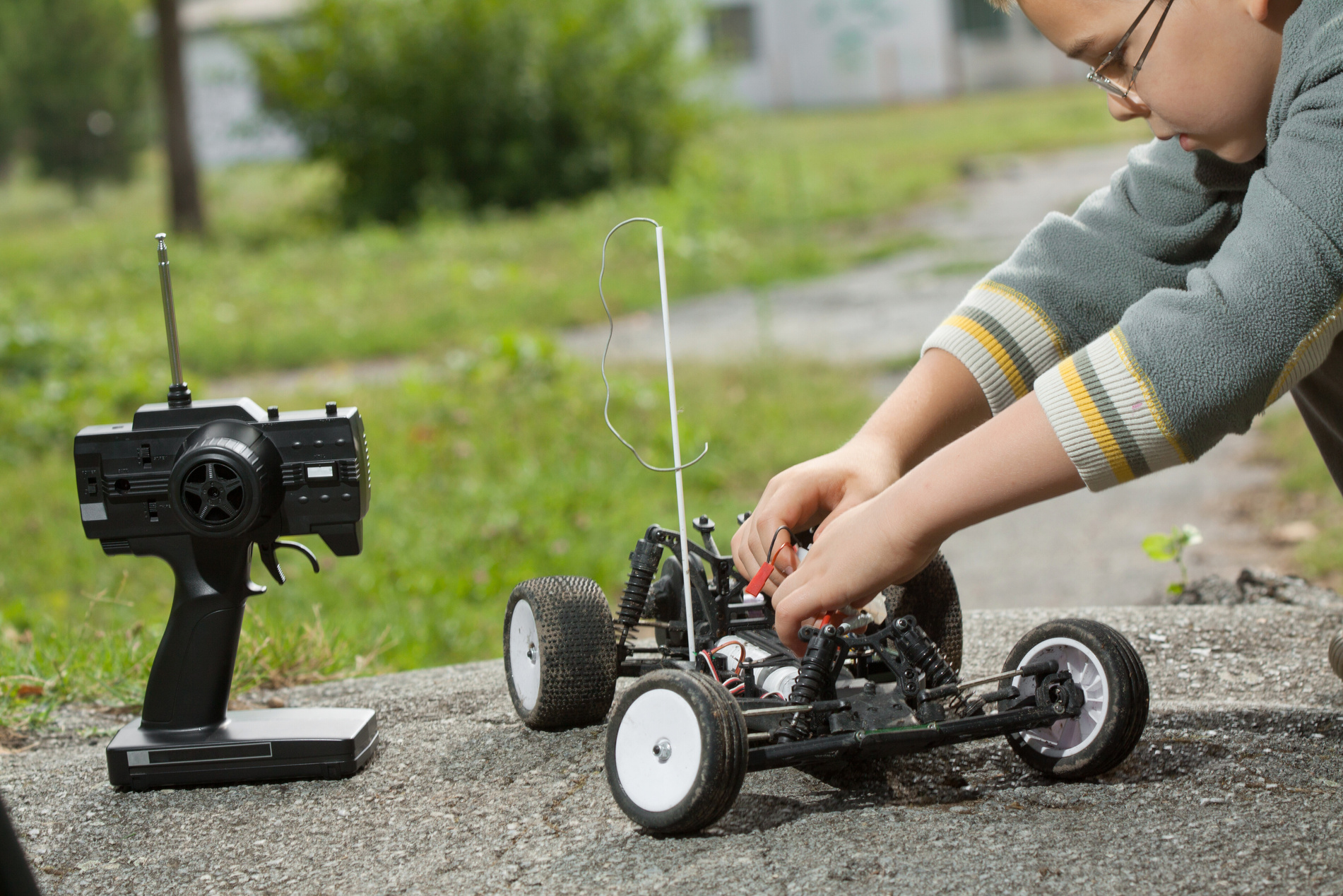 CHILD WITH RC CAR